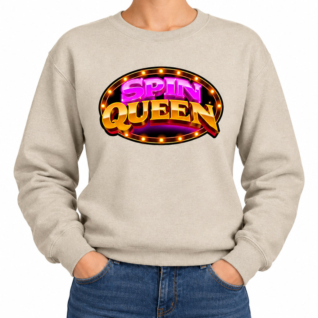 A beige crewneck sweatshirt featuring a colorful 'SPIN QUEEN' graphic on the chest, modeled on a person against a plain white background.