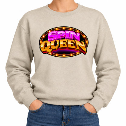 A beige crewneck sweatshirt featuring a colorful 'SPIN QUEEN' graphic on the chest, modeled on a person against a plain white background.
